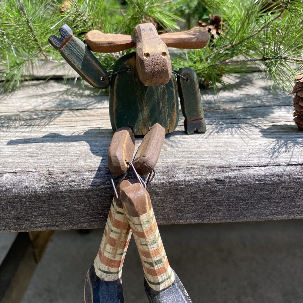 Moose Sitting on Shelf